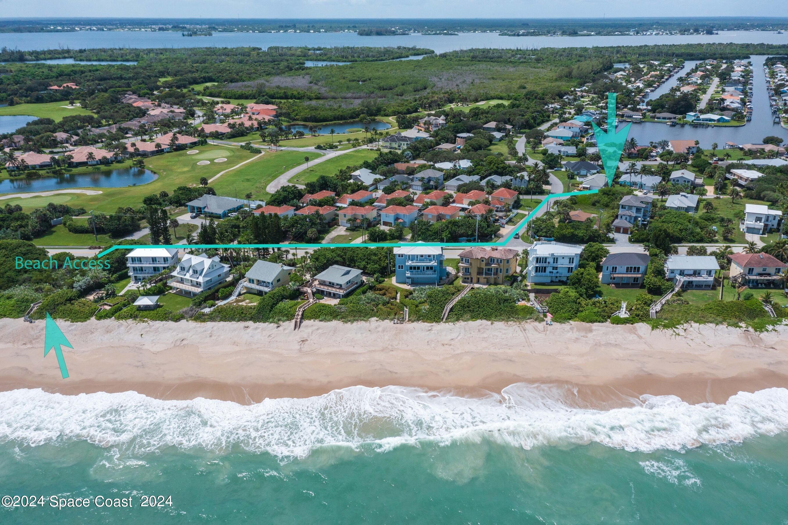 7308 Stuart Avenue Melbourne Beach, FL 32951 - Photo 3 of 16 a view of a street with a bunch of flowers