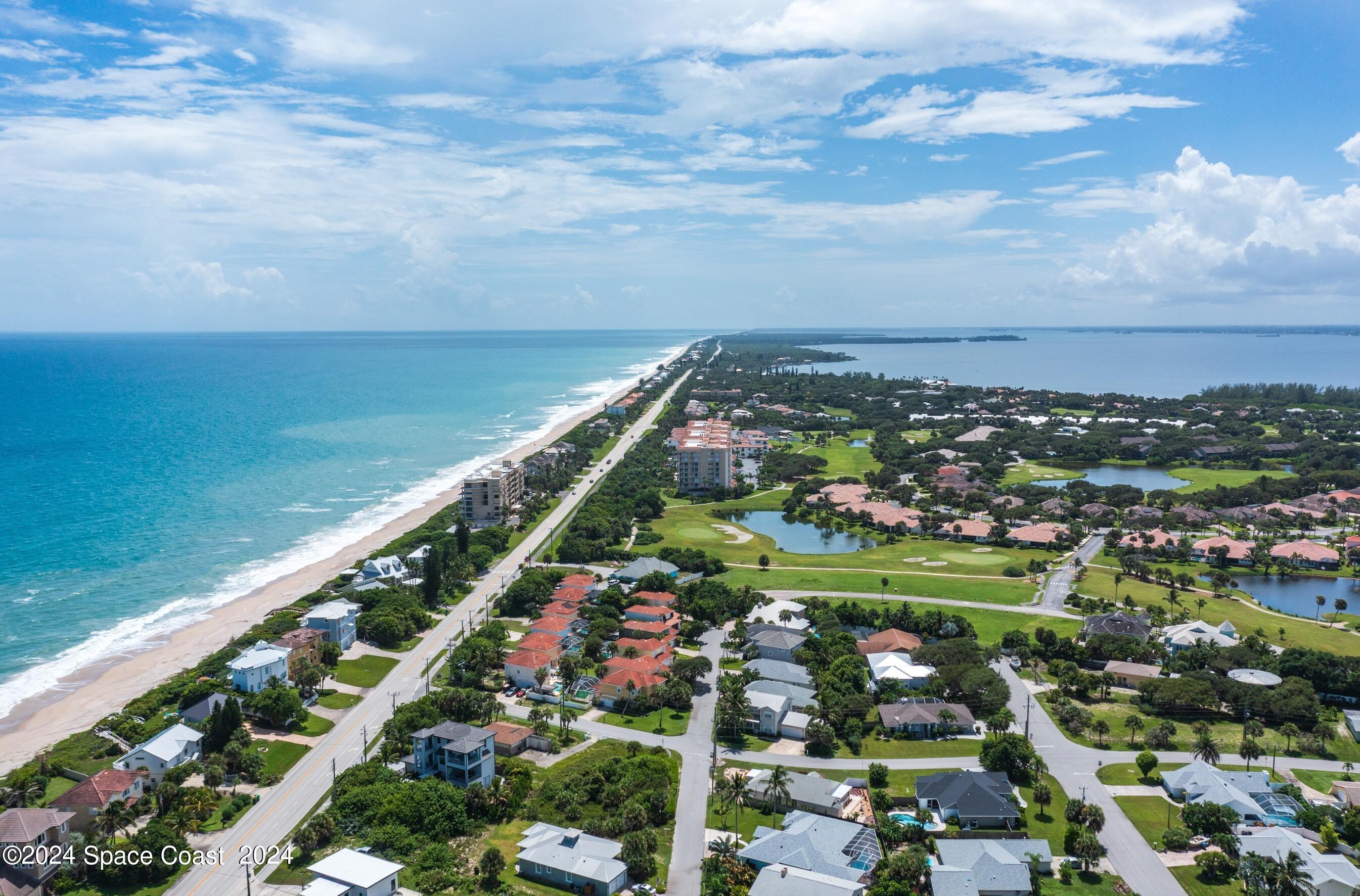 7308 Stuart Avenue Melbourne Beach, FL 32951 - Photo 9 of 16 a view of a city and ocean view