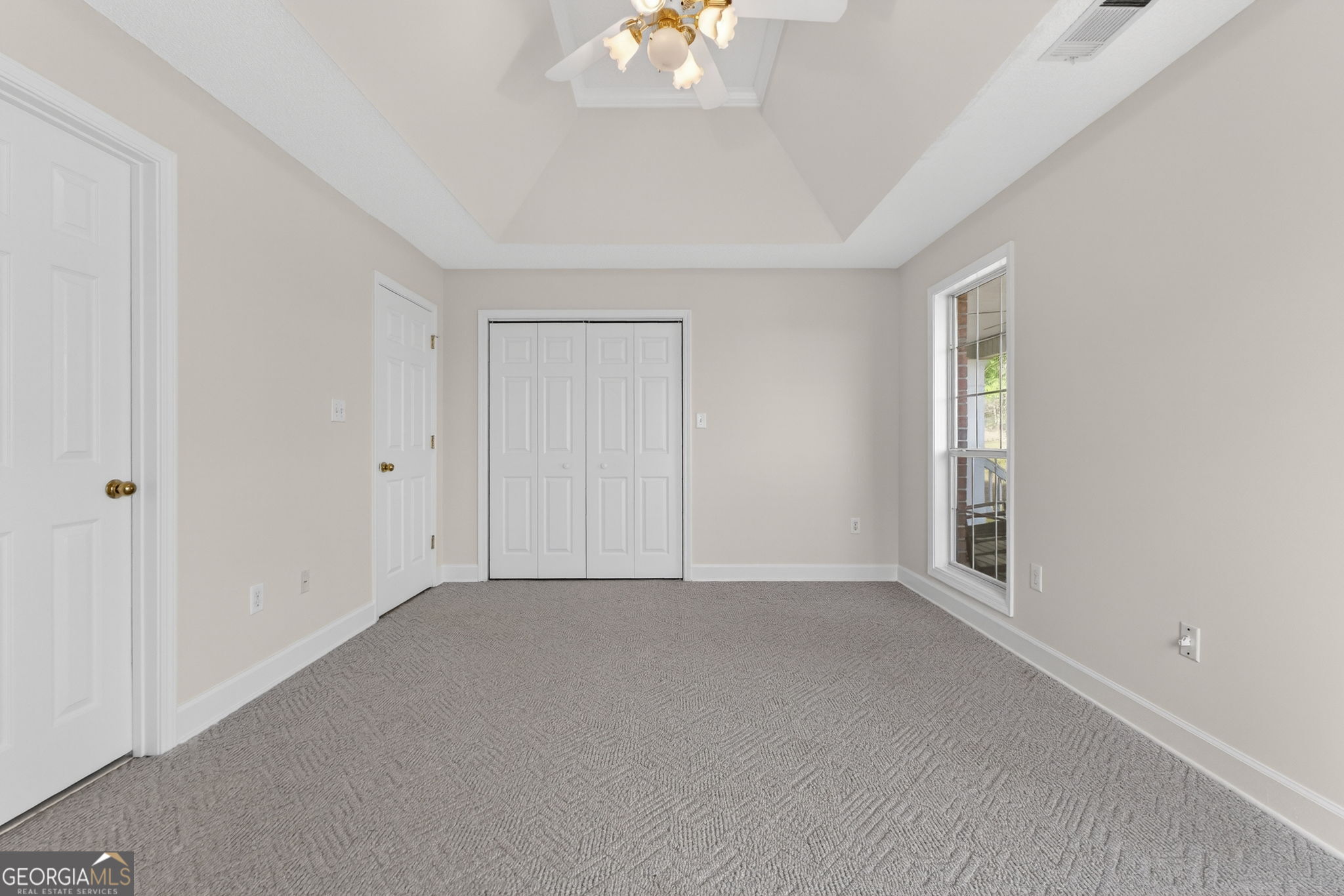 955 Mocassin Gap Road Locust Grove, GA 30248 - Photo 27 of 59 a view of an empty room with a window
