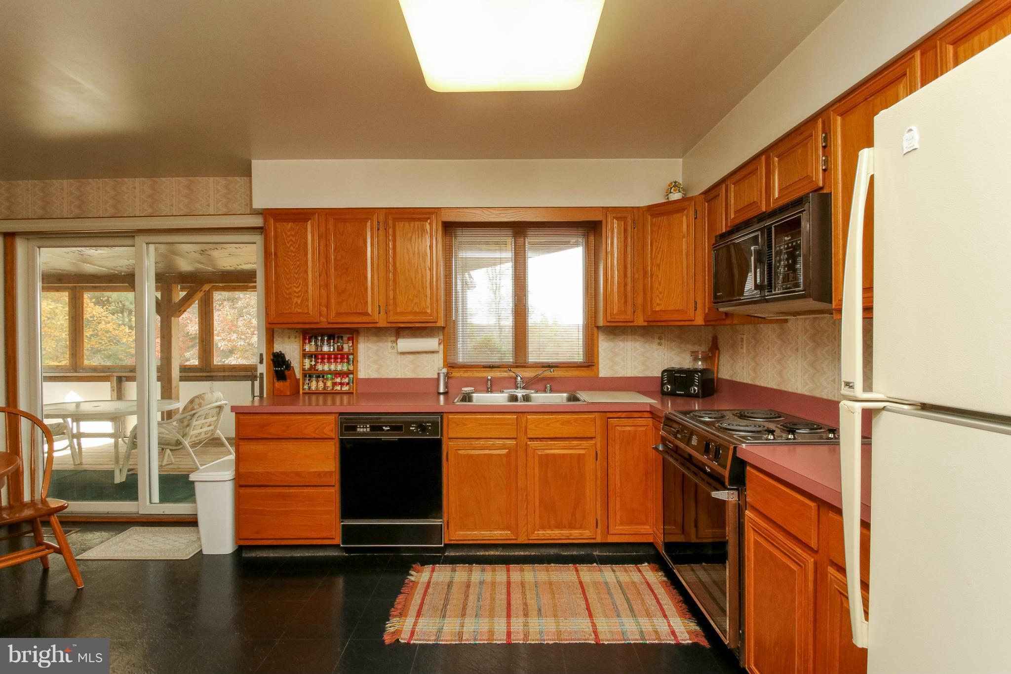 511 East Quaker Bottom Road Sparks, MD 21152 - Photo 5 of 30 a kitchen with stainless steel appliances granite countertop a stove a sink and a microwave