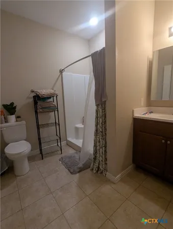 a bathroom with a toilet and a sink