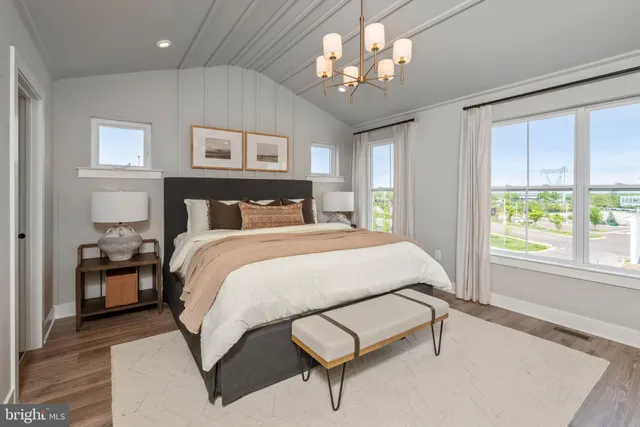 a bedroom with a bed and a mirror