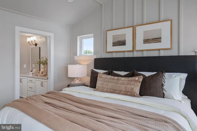 a bedroom with bed and window