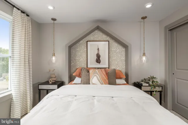 a bedroom with furniture and a window