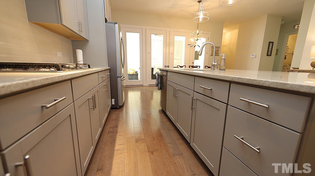 5526 Beardall Street Raleigh, NC 27616 - Photo 15 of 34 Attractive grey cabinets and view out to Screen Porch.