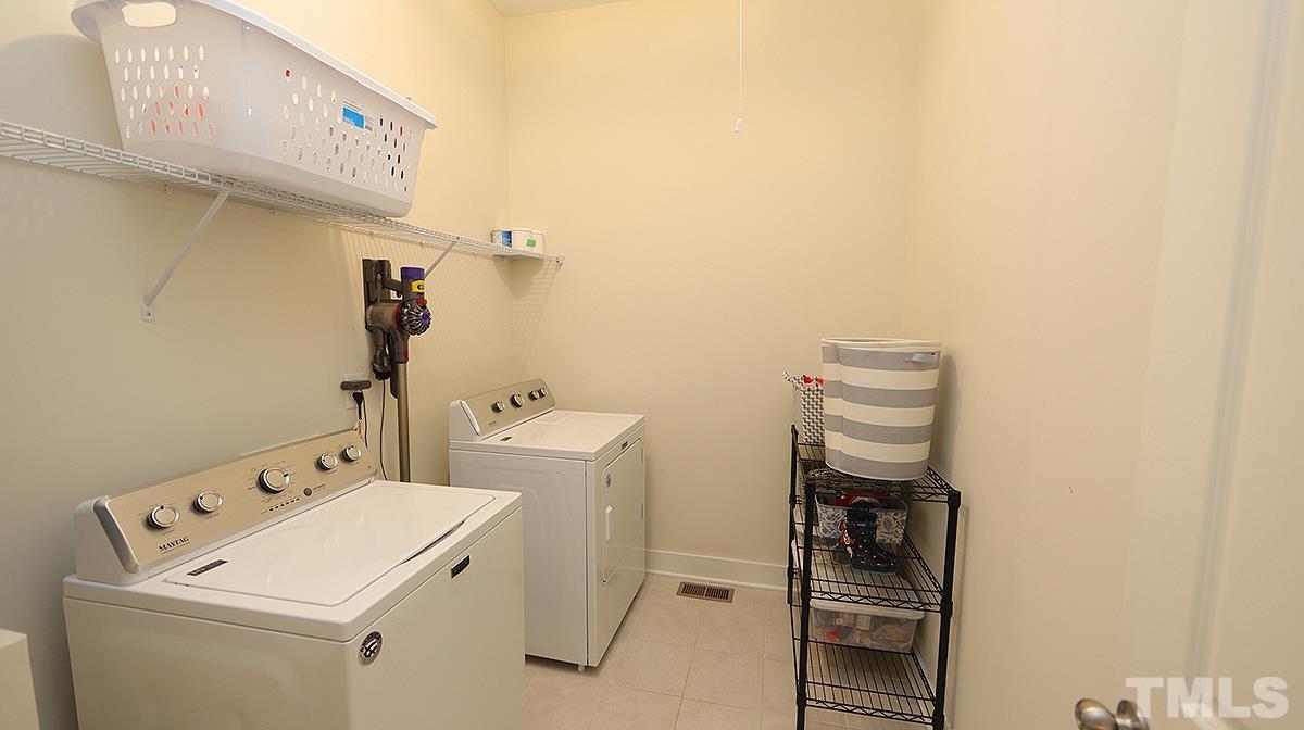 5526 Beardall Street Raleigh, NC 27616 - Photo 21 of 34 Nice size Laundry Room on 1st floor just outside the Master Bedroom.