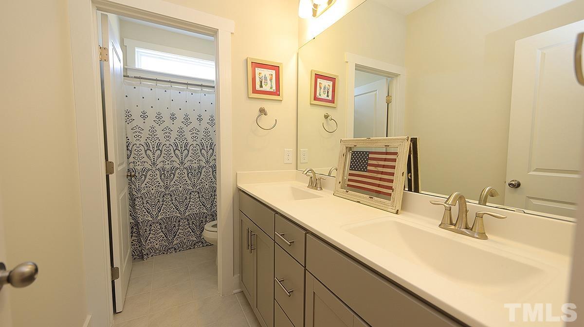 5526 Beardall Street Raleigh, NC 27616 - Photo 26 of 34 Attractive full Bath on 2nd floor between 3 Bedrooms.