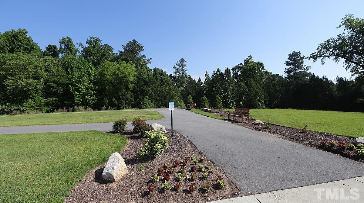 5526 Beardall Street Raleigh, NC 27616 - Photo 31 of 34 One of the best locations in the neighborhood with only green to view across the street instead of other homes and easy access to the park, playground and trails!