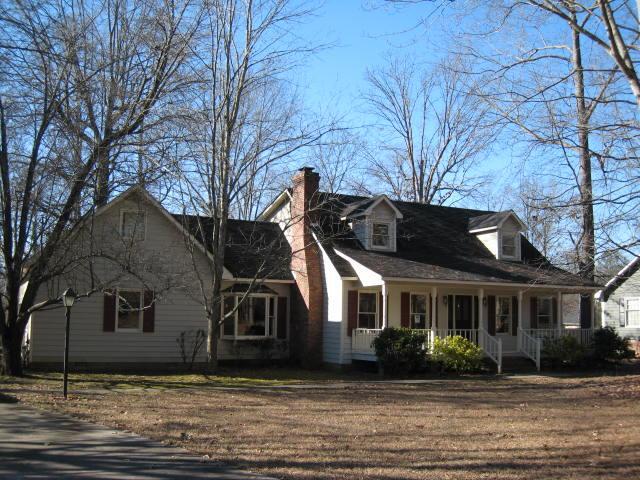 105 Sunridge Drive Rome, GA 30165 - Photo 1 of 1 a front view of a house with a garden