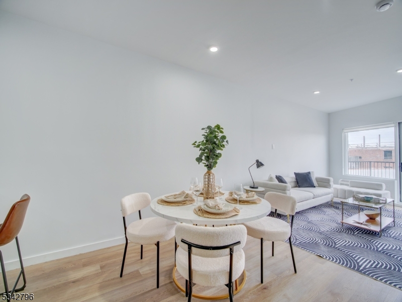 486 Market Street Newark, NJ 07105 - Photo 21 of 34 a view of a dining room with furniture and wooden floor