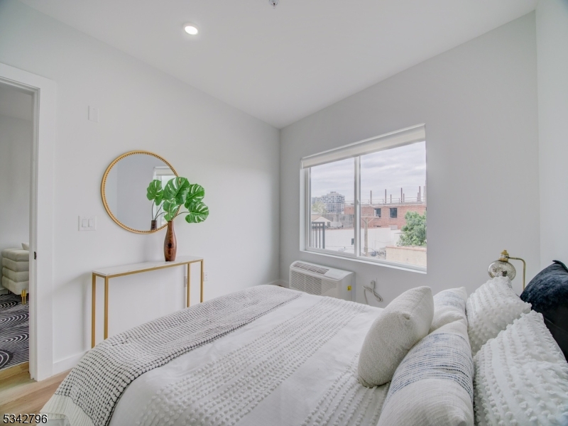486 Market Street Newark, NJ 07105 - Photo 29 of 34 a bedroom with a bed and a window