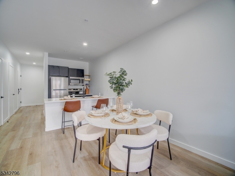 486 Market Street Newark, NJ 07105 - Photo 30 of 34 a view of a dining room with furniture and wooden floor