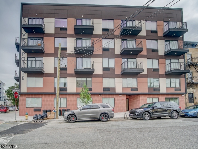 486 Market Street Newark, NJ 07105 - Photo 4 of 34 a car parked in front of a store