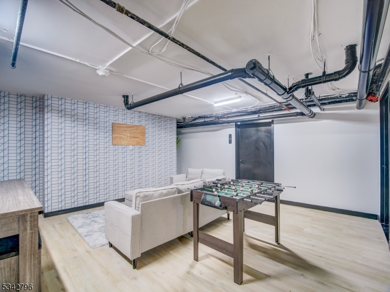 486 Market Street Newark, NJ 07105 - Photo 6 of 34 a living room with furniture and a wooden floor