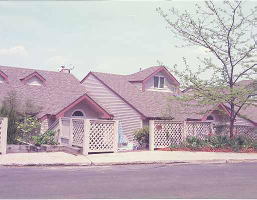 101 Algonquin Road, Unit 101 Newton, MA 02467 - Photo 1 of 1 front view of a house with a yard