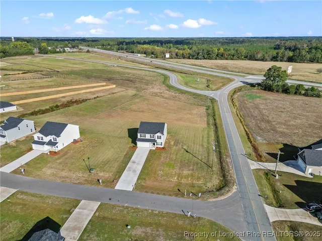 a view of a swimming pool and an outdoor seating