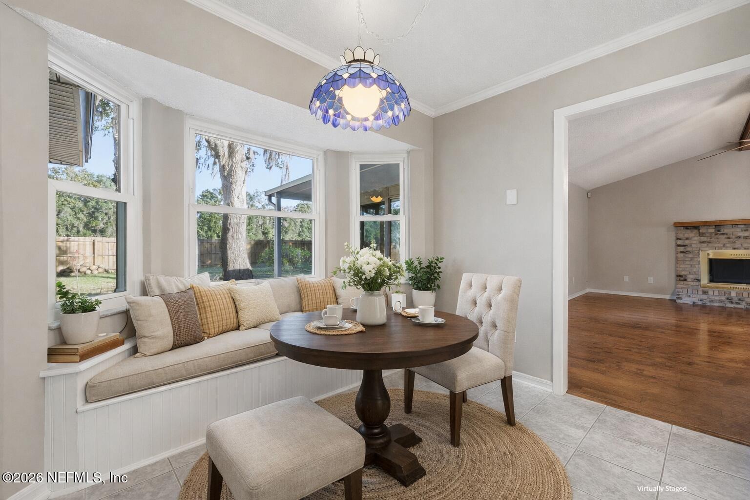 3225 Trophy Place Jacksonville, FL 32225 - Photo 6 of 30 a living room with furniture and a large window