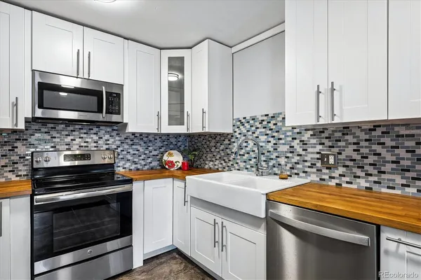 a kitchen with a stove and a microwave