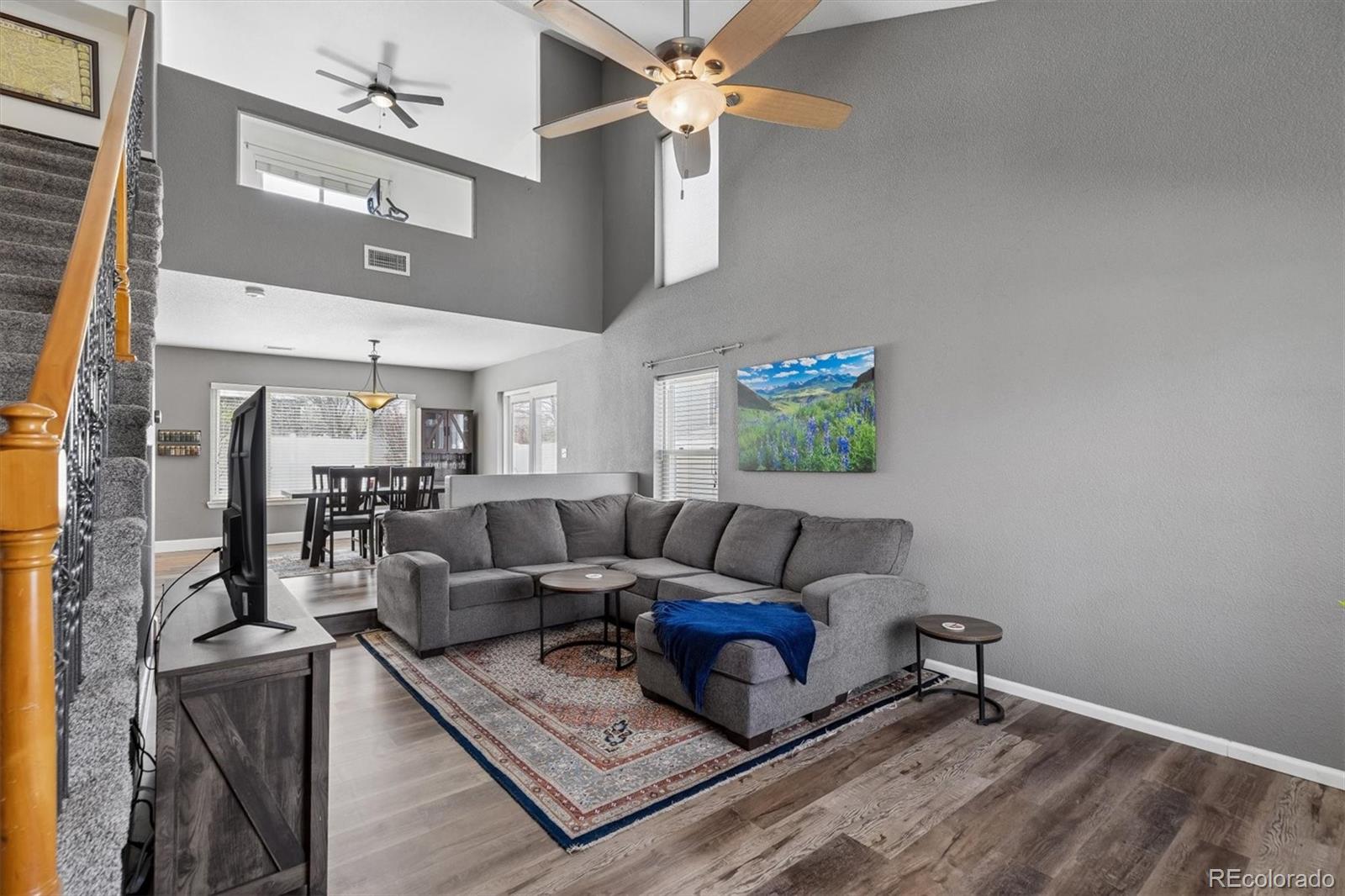4983 Halifax Court Denver, CO 80249 - Photo 2 of 17 a living room with furniture and a rug