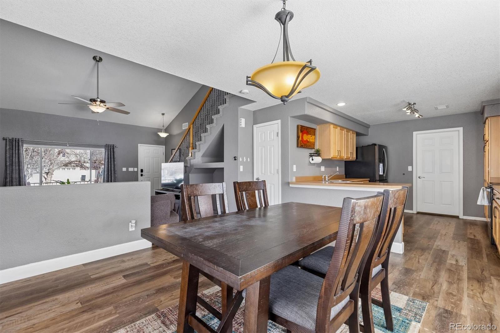 4983 Halifax Court Denver, CO 80249 - Photo 5 of 17 a dining room with furniture and window