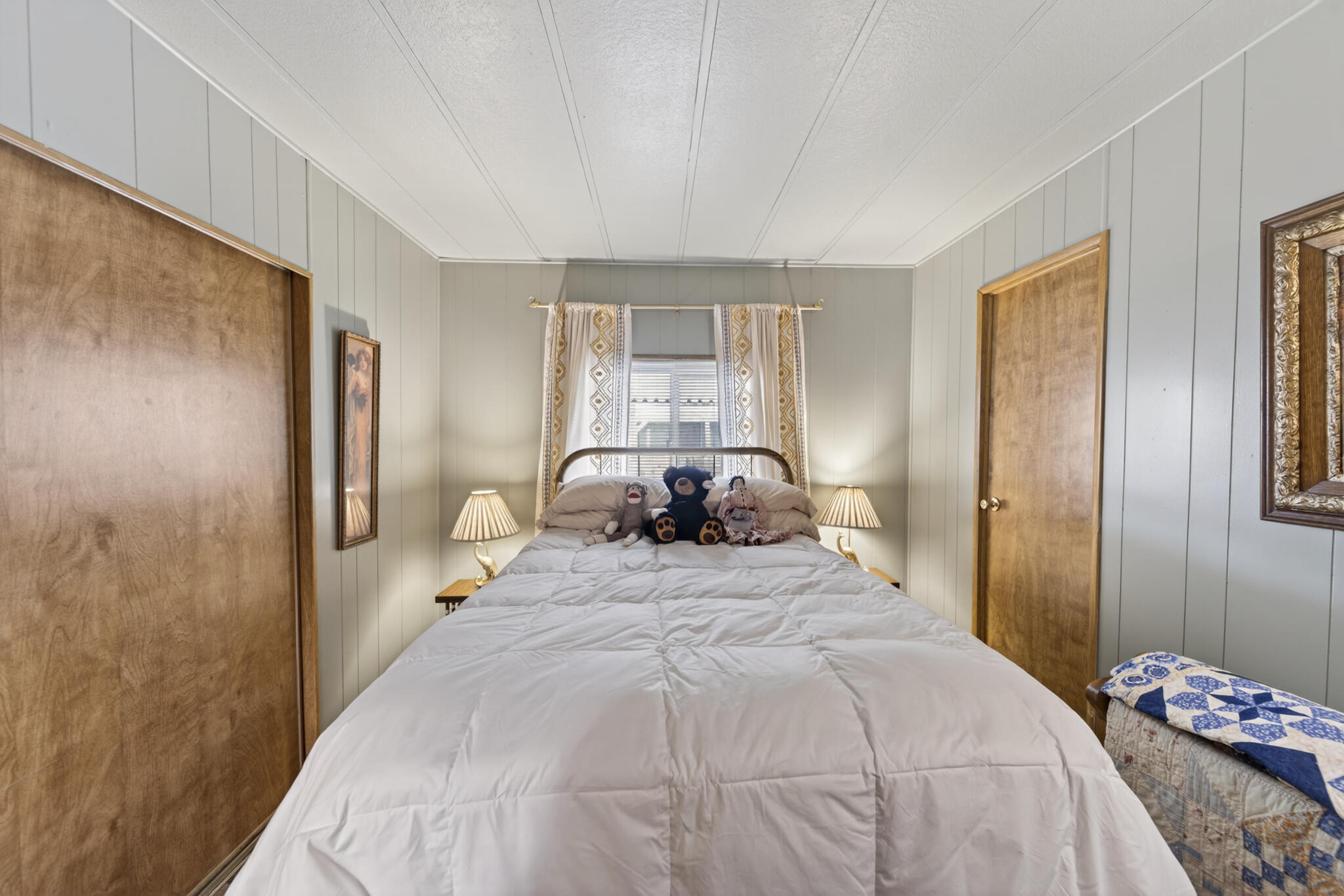 1059 Eagle Nest Road Redding, CA 96003 - Photo 13 of 44 a bedroom with a bed and a window