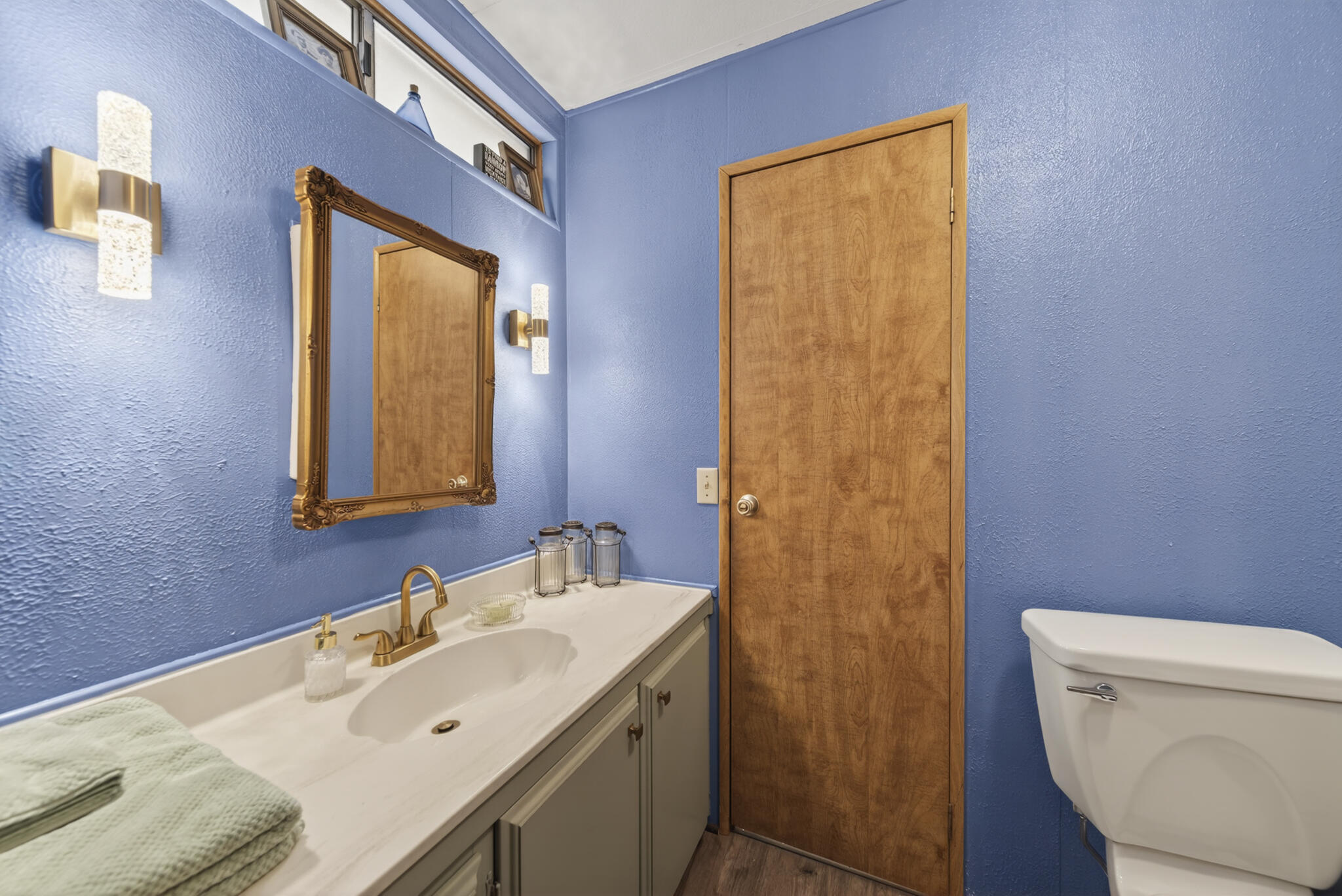 1059 Eagle Nest Road Redding, CA 96003 - Photo 16 of 44 a bathroom with a sink a toilet and mirror