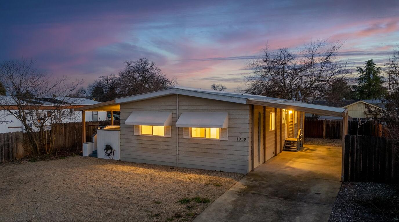 1059 Eagle Nest Road Redding, CA 96003 - Photo 2 of 44 a view of house with yard and garage