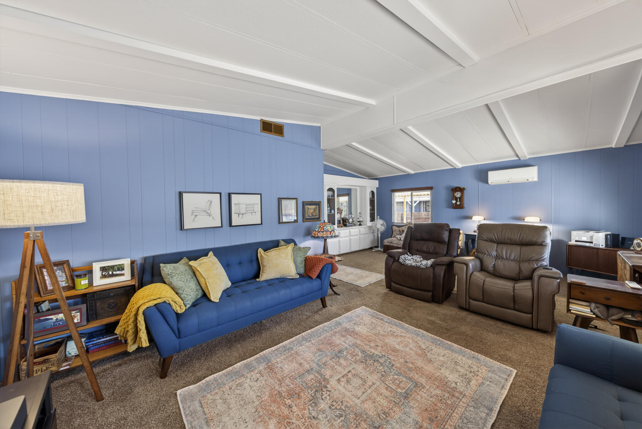 1059 Eagle Nest Road Redding, CA 96003 - Photo 21 of 44 a living room with furniture a rug and a lamp