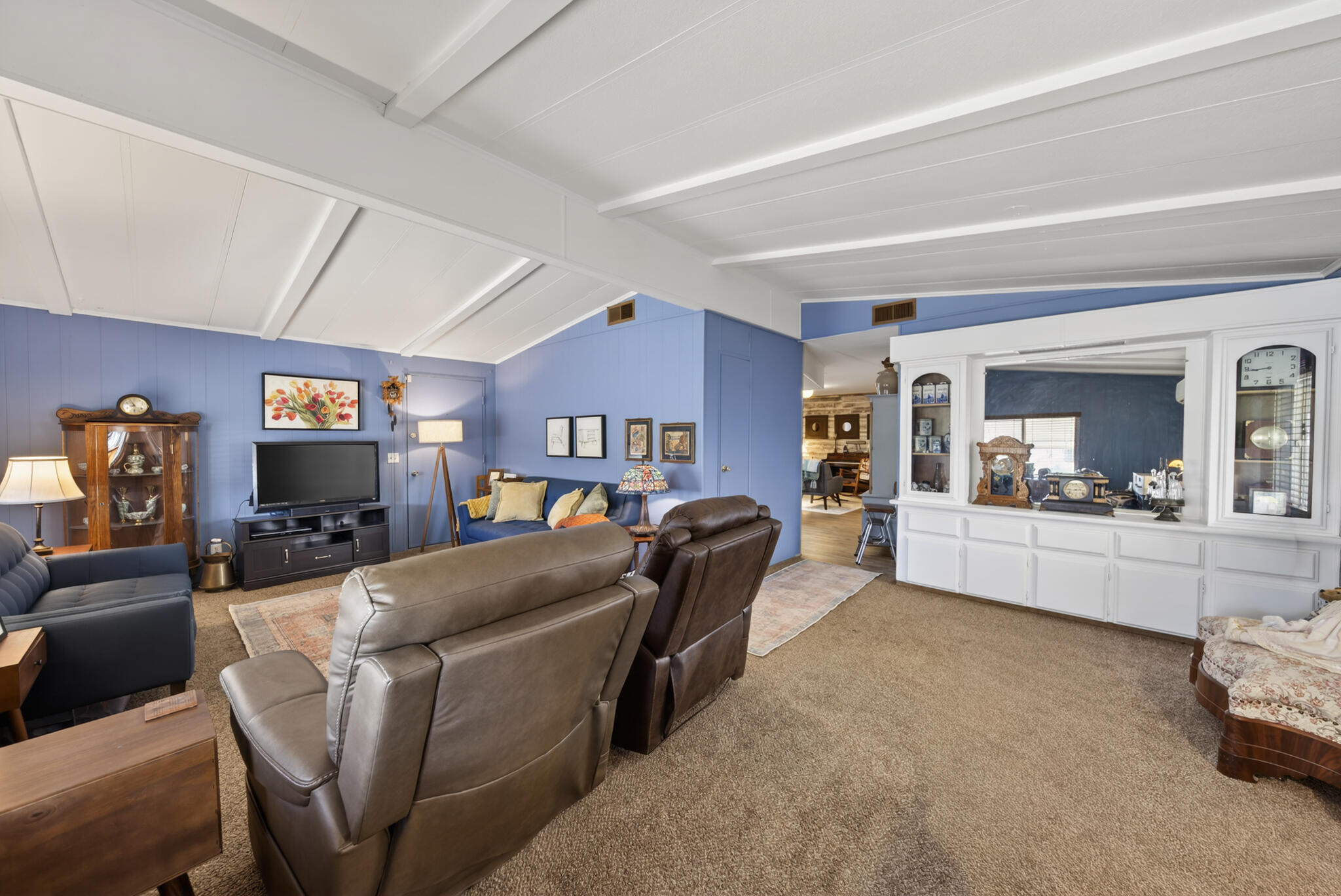1059 Eagle Nest Road Redding, CA 96003 - Photo 23 of 44 a living room with furniture and a flat screen tv
