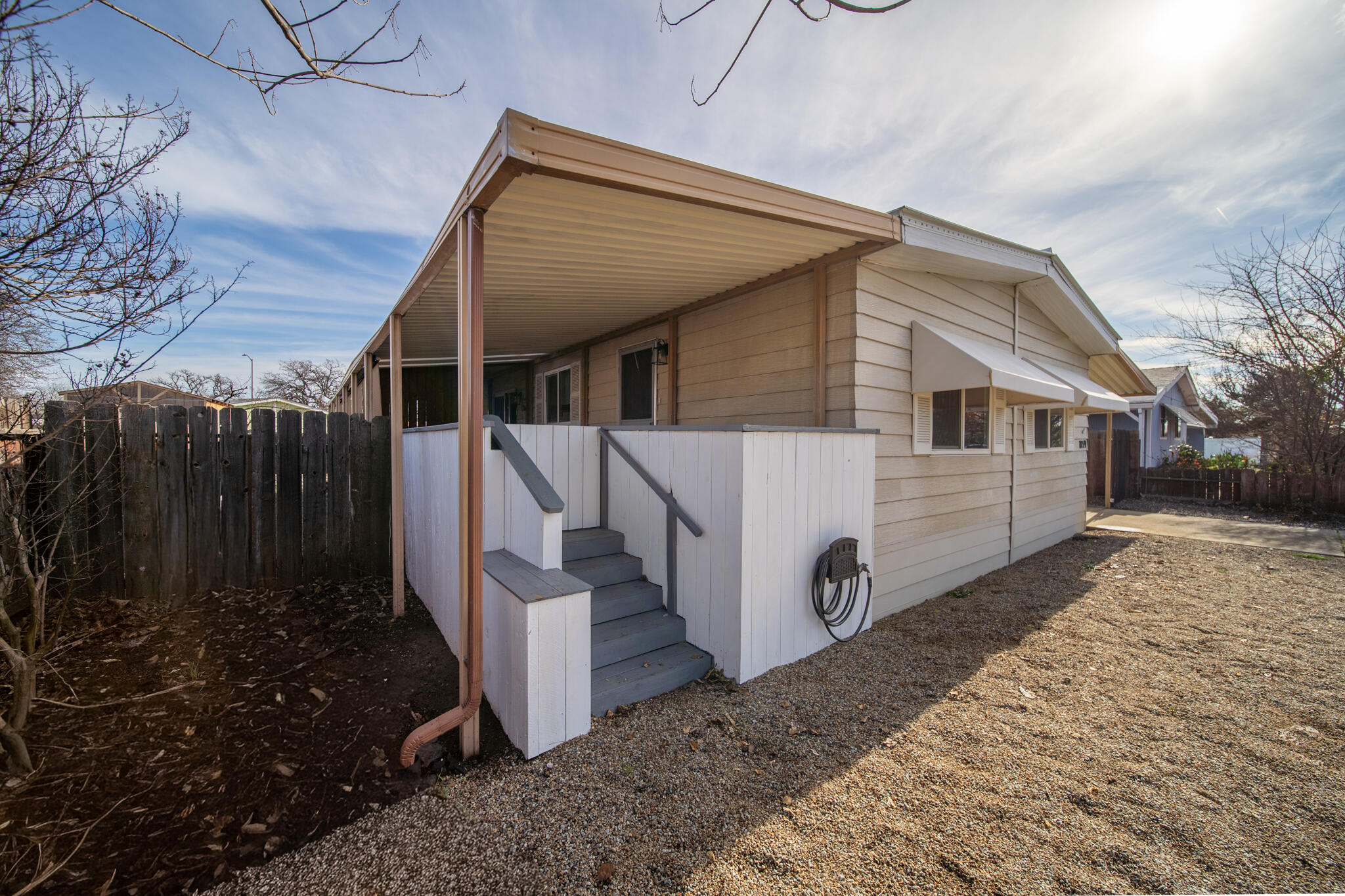 1059 Eagle Nest Road Redding, CA 96003 - Photo 26 of 44 a view of a house with backyard and wooden fence