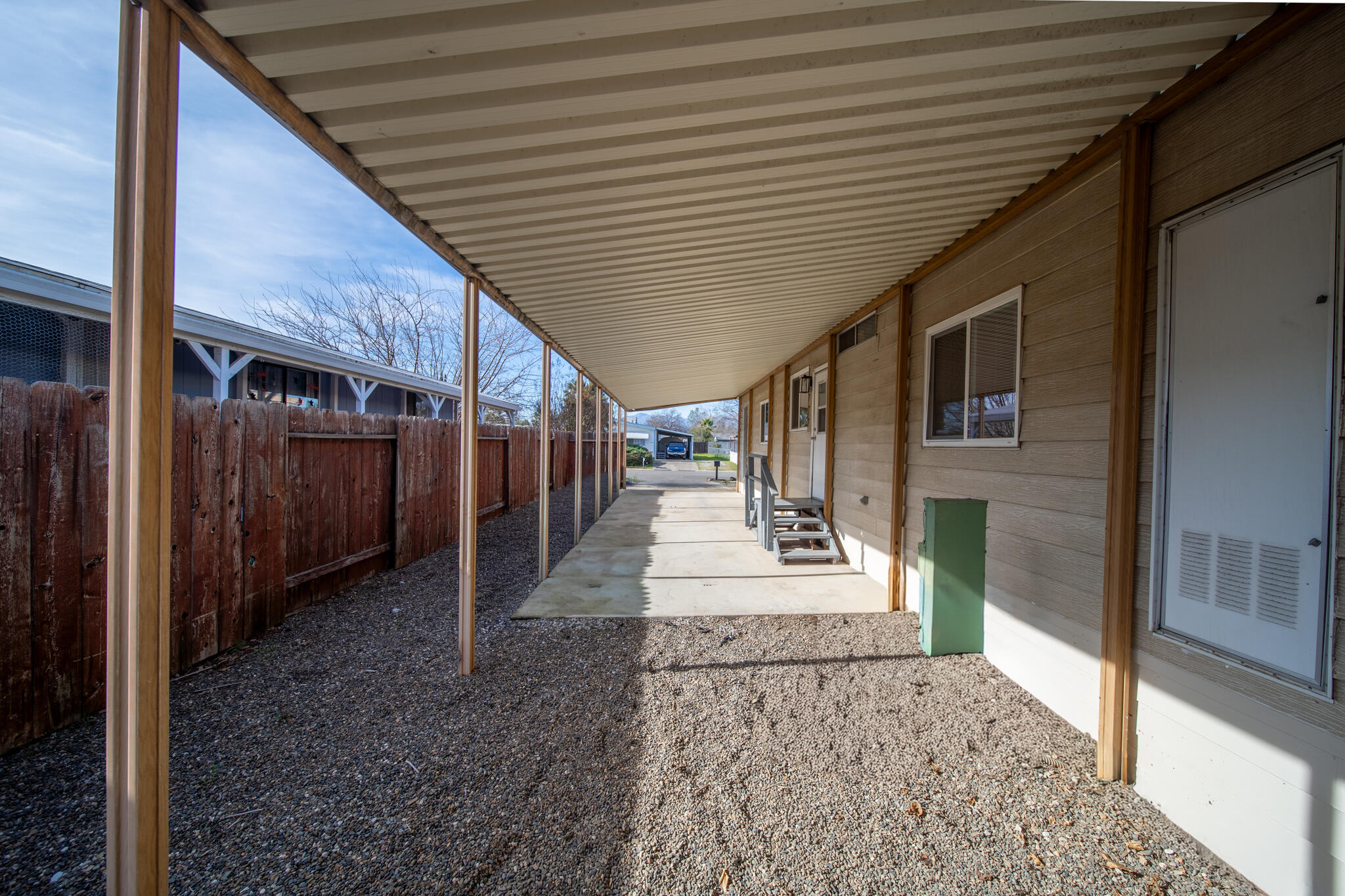 1059 Eagle Nest Road Redding, CA 96003 - Photo 33 of 44 a view of a porch with furniture and a gate