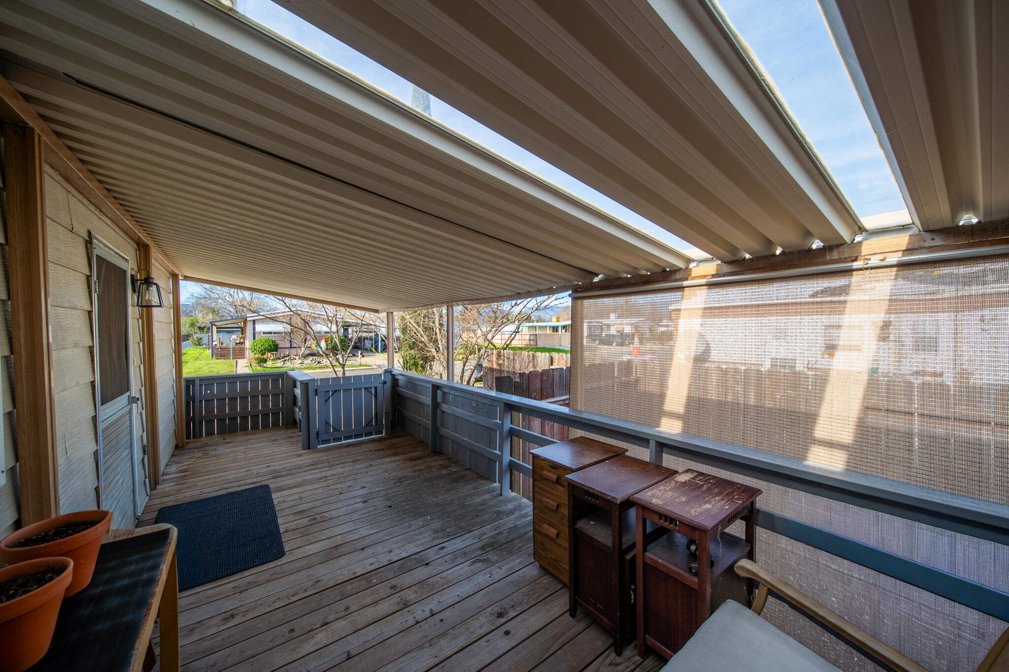 1059 Eagle Nest Road Redding, CA 96003 - Photo 38 of 44 a view of a porch with furniture and wooden floors