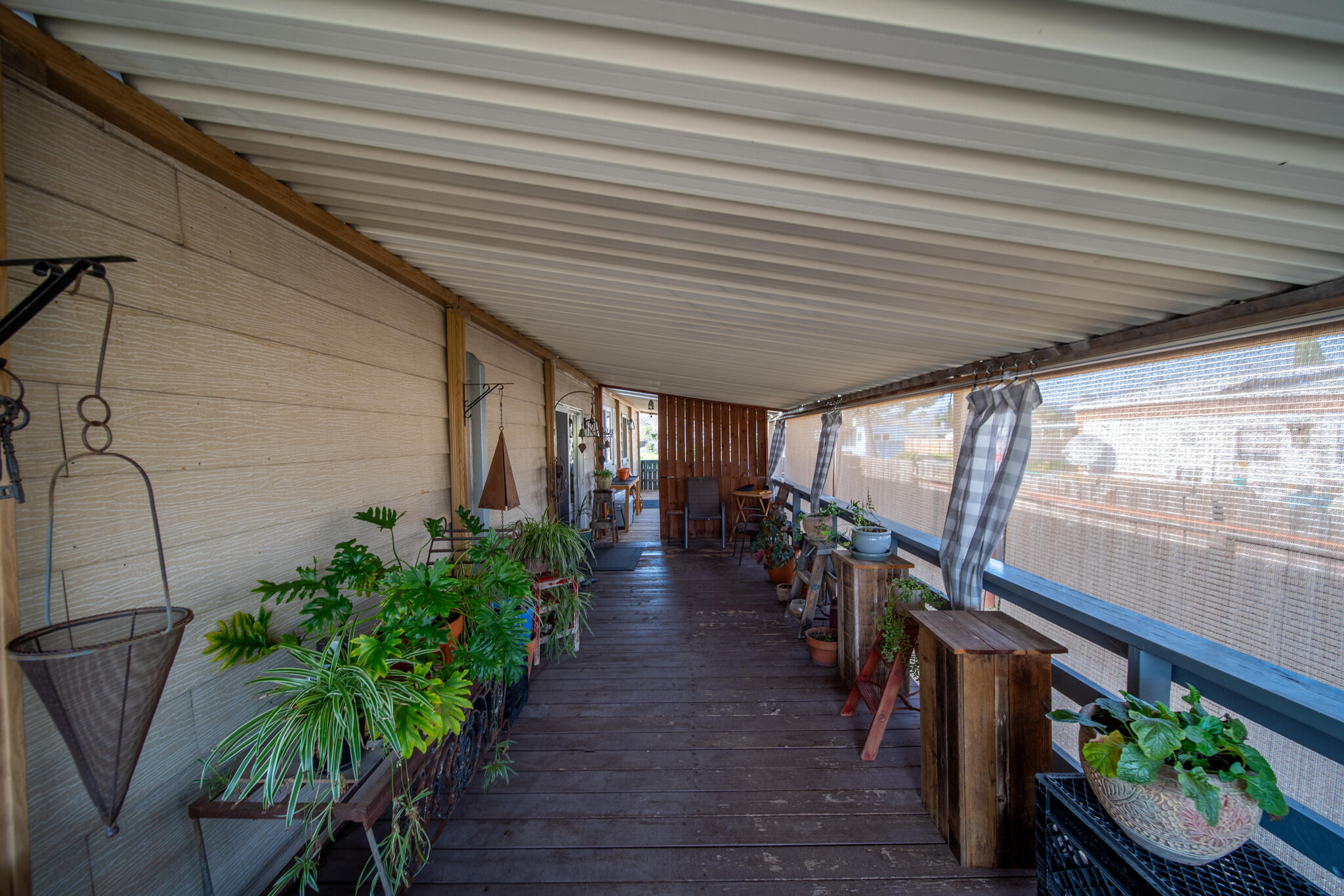 1059 Eagle Nest Road Redding, CA 96003 - Photo 44 of 44 a view of a porch with chairs and potted plants