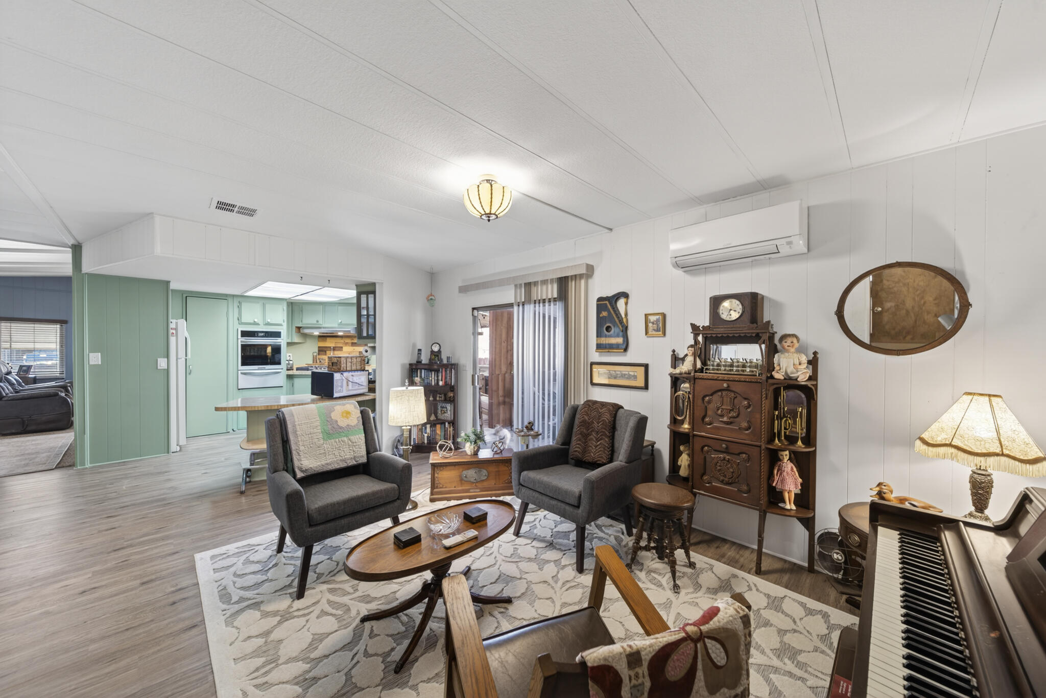 1059 Eagle Nest Road Redding, CA 96003 - Photo 6 of 44 a living room with furniture a rug and kitchen view