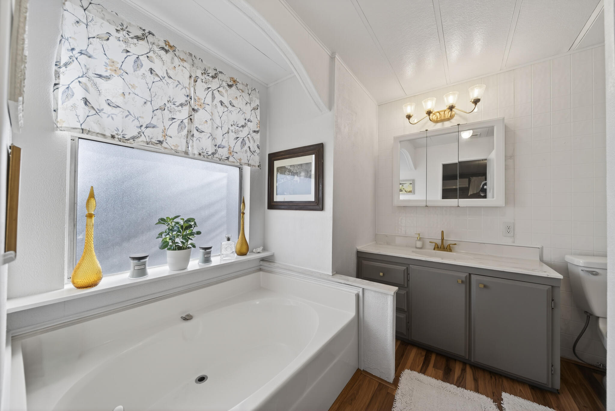1059 Eagle Nest Road Redding, CA 96003 - Photo 10 of 44 a bathroom with a sink mirror and vanity