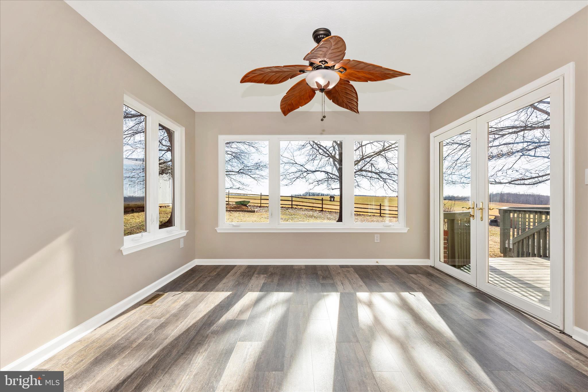 14695 Oak Orchard Road New Windsor, MD 21776 - Photo 16 of 57 a view of an empty room with wooden floor and a window