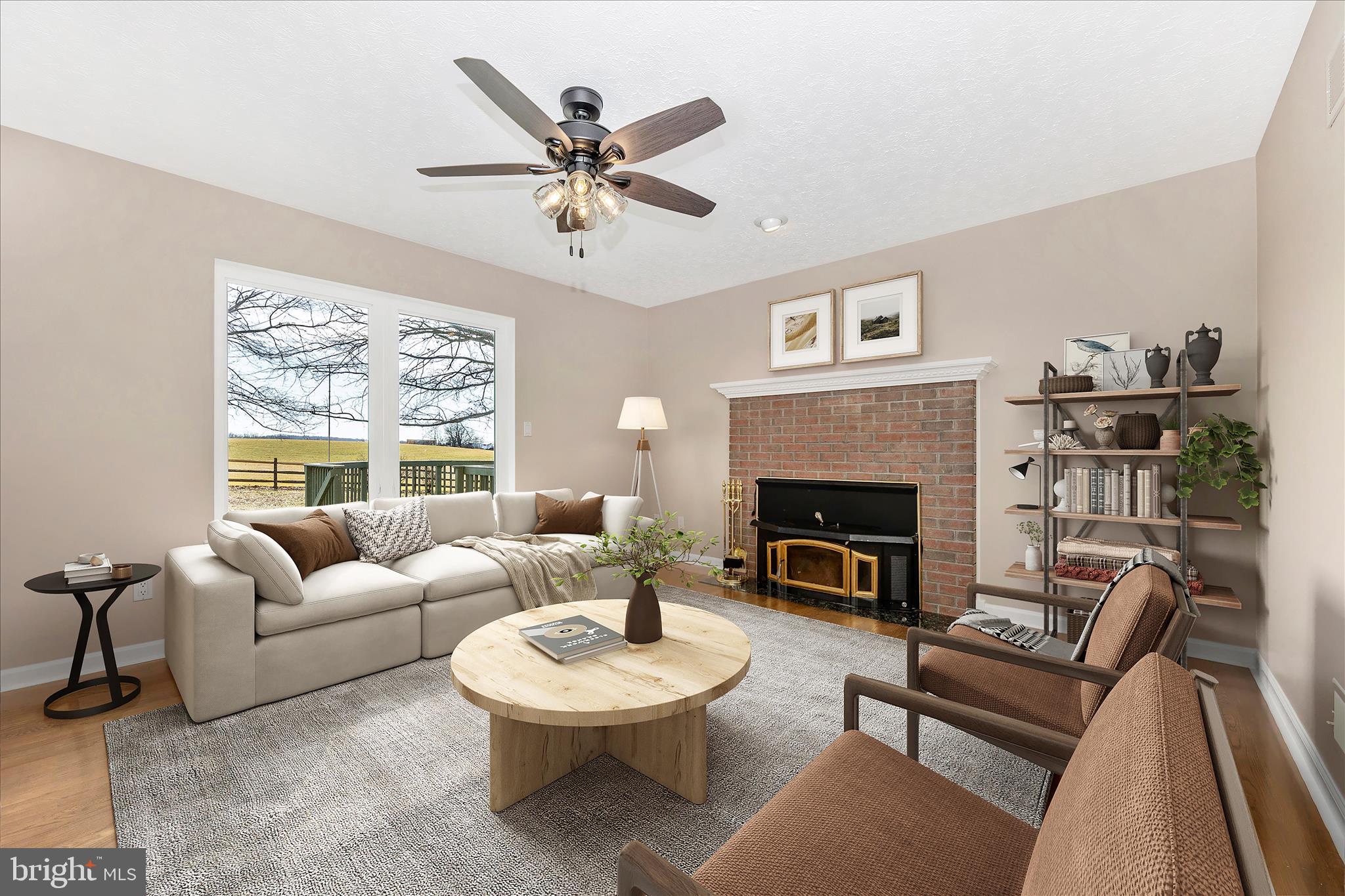 14695 Oak Orchard Road New Windsor, MD 21776 - Photo 20 of 57 a living room with furniture a fireplace and a large mirror