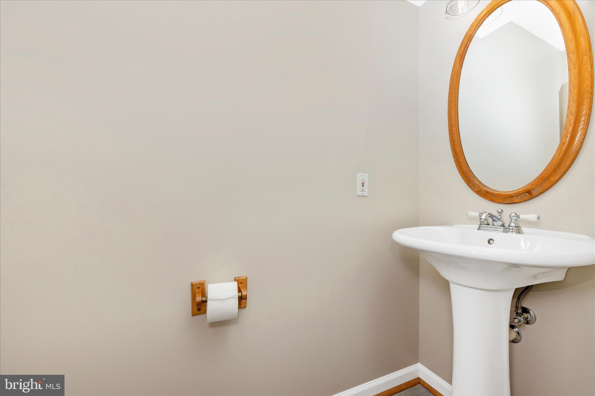 14695 Oak Orchard Road New Windsor, MD 21776 - Photo 25 of 57 a bathroom with a sink and a mirror