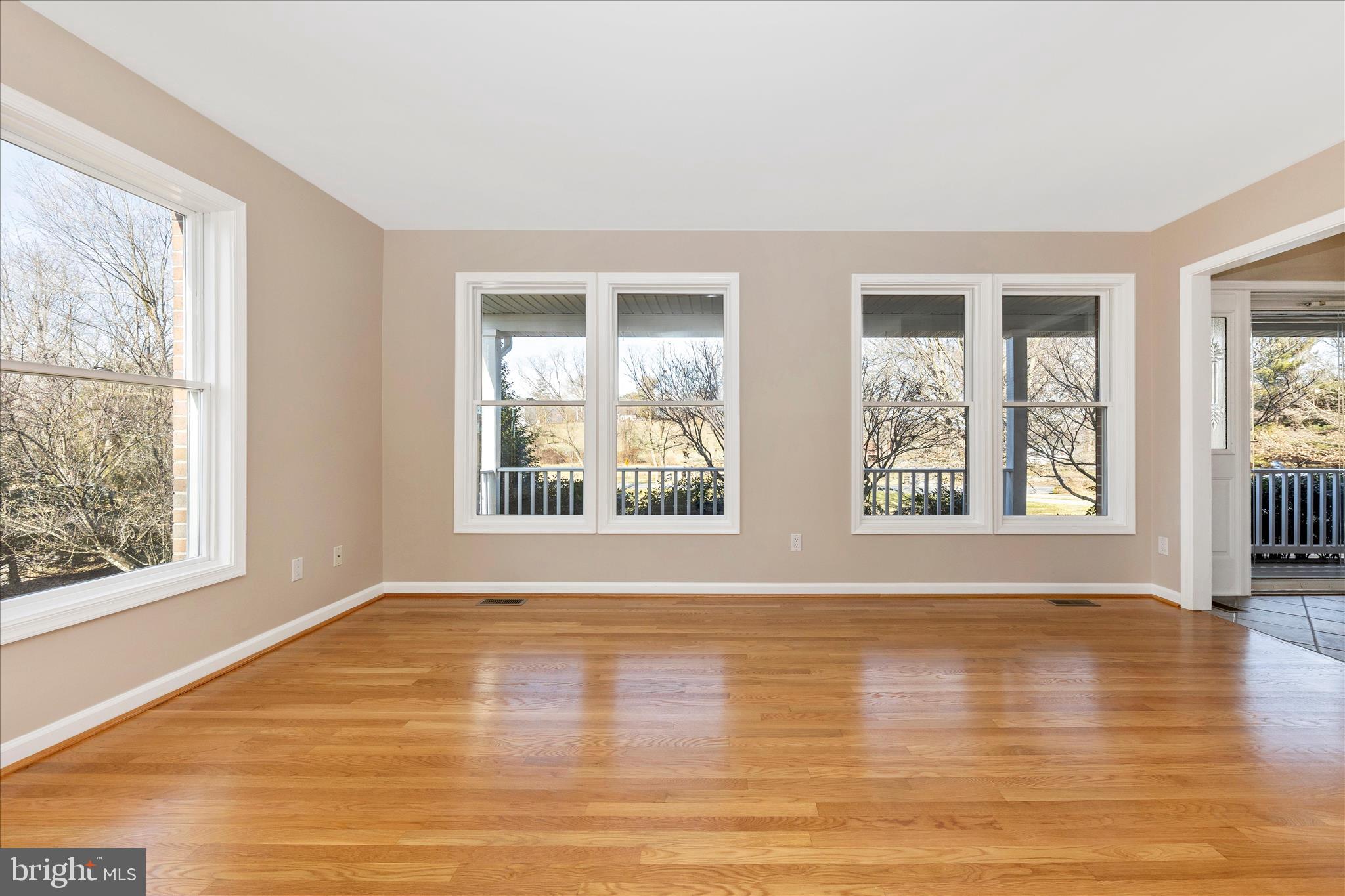 14695 Oak Orchard Road New Windsor, MD 21776 - Photo 4 of 57 a view of an empty room with wooden floor and a window