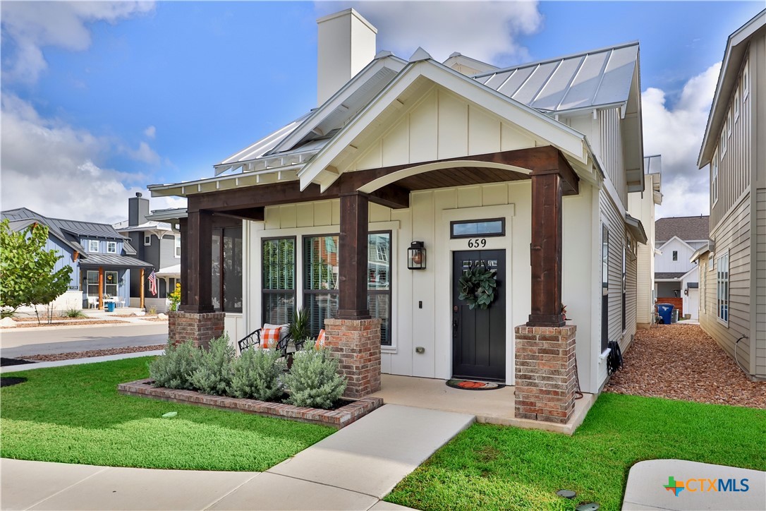 659 Prospect Way New Braunfels, TX 78130 - Photo 1 of 32 a front view of a house with a yard