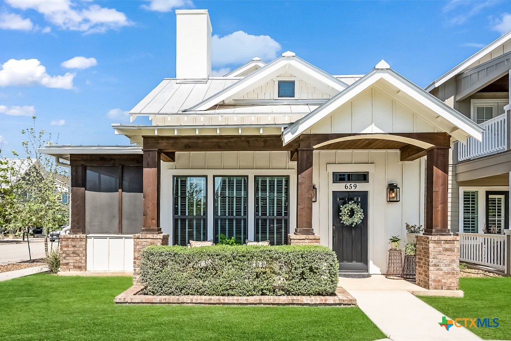659 Prospect Way New Braunfels, TX 78130 - Photo 2 of 32 a front view of a house with a yard