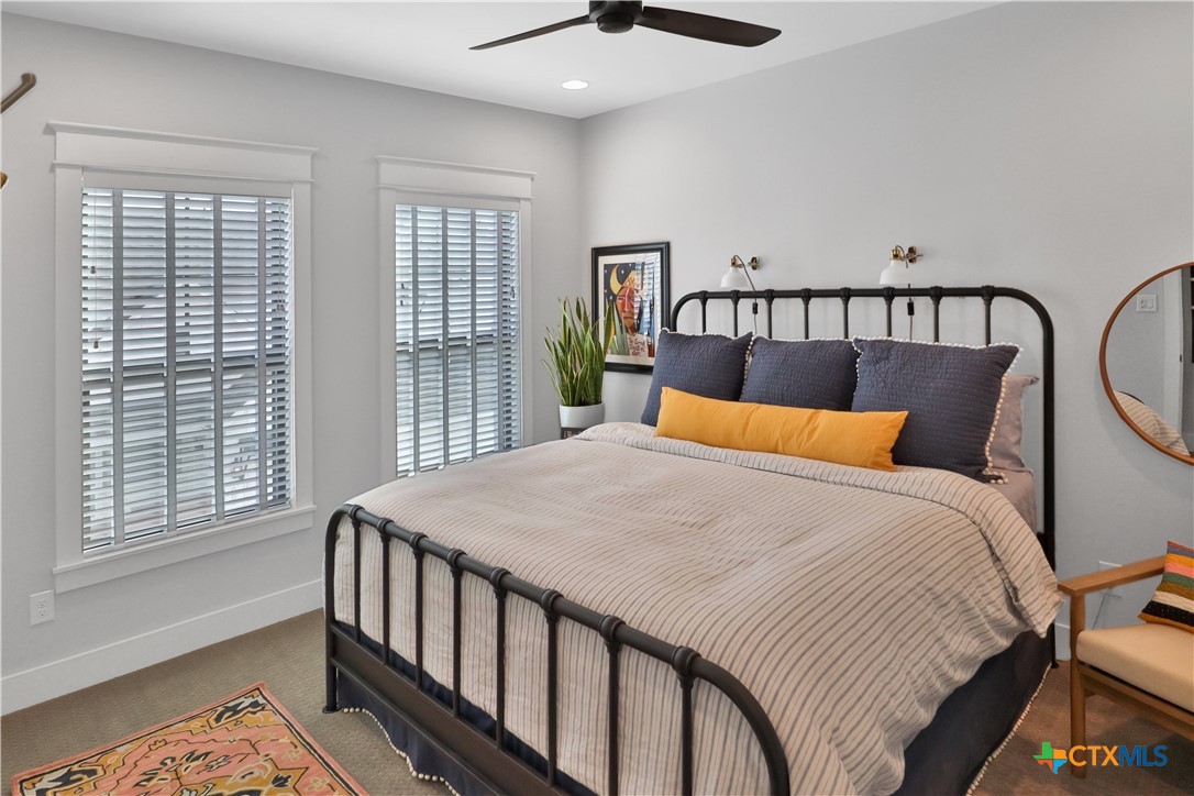 659 Prospect Way New Braunfels, TX 78130 - Photo 26 of 32 a bed sitting in a bedroom next to a window