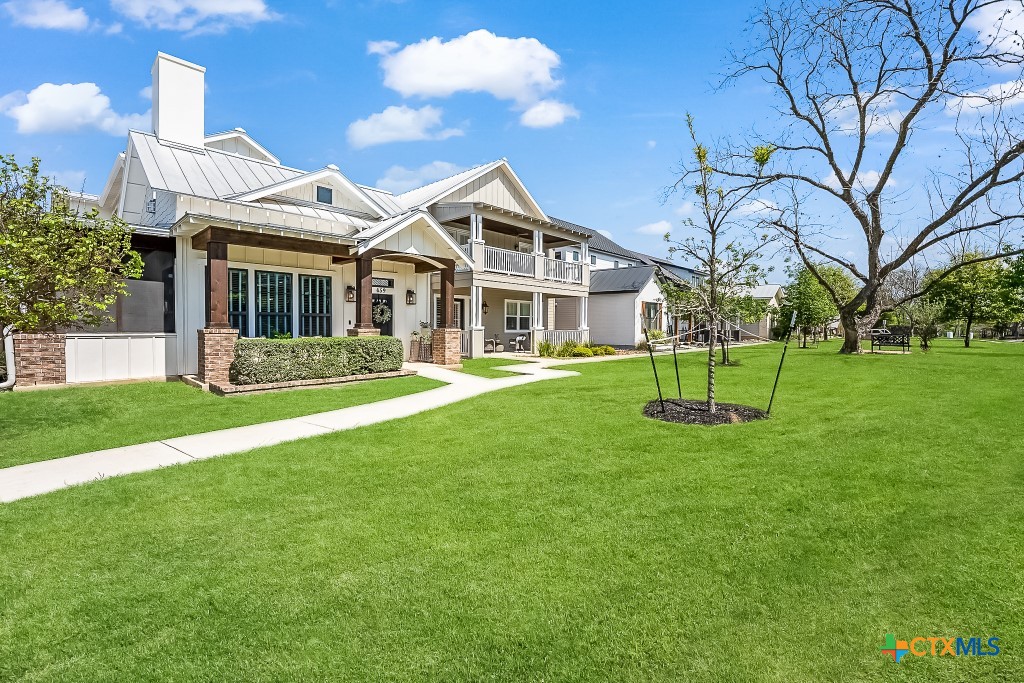 659 Prospect Way New Braunfels, TX 78130 - Photo 3 of 32 a front view of a house with a yard