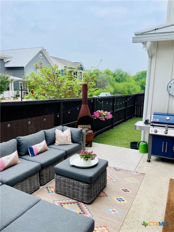 659 Prospect Way New Braunfels, TX 78130 - Photo 31 of 32 a view of a patio with couches table and chairs with potted plants