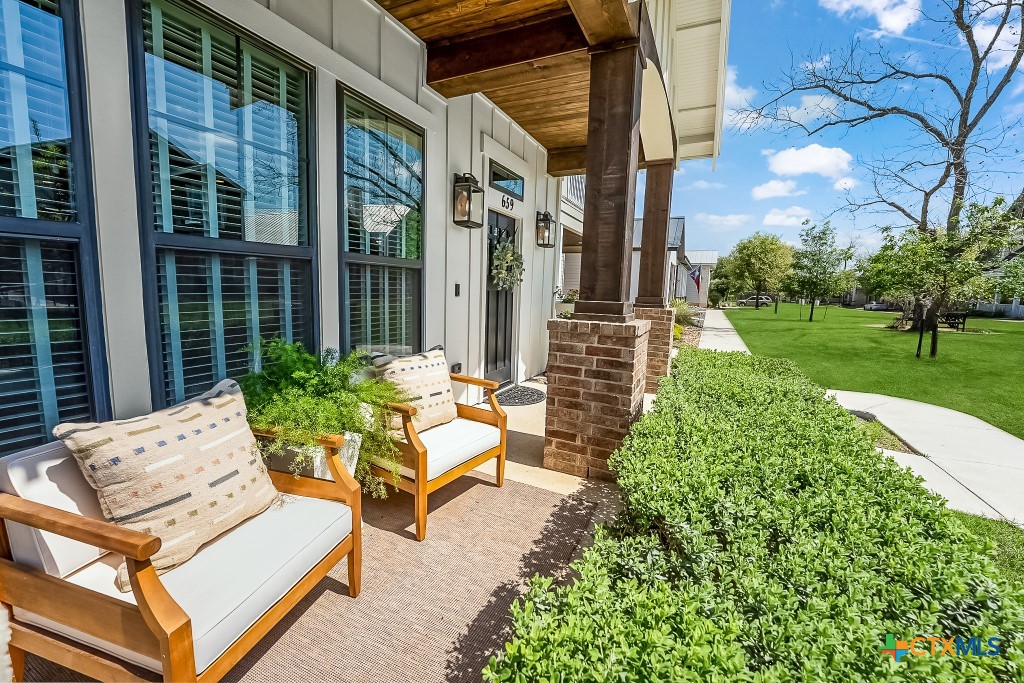 659 Prospect Way New Braunfels, TX 78130 - Photo 4 of 32 a view of backyard of house with outdoor seating and green space