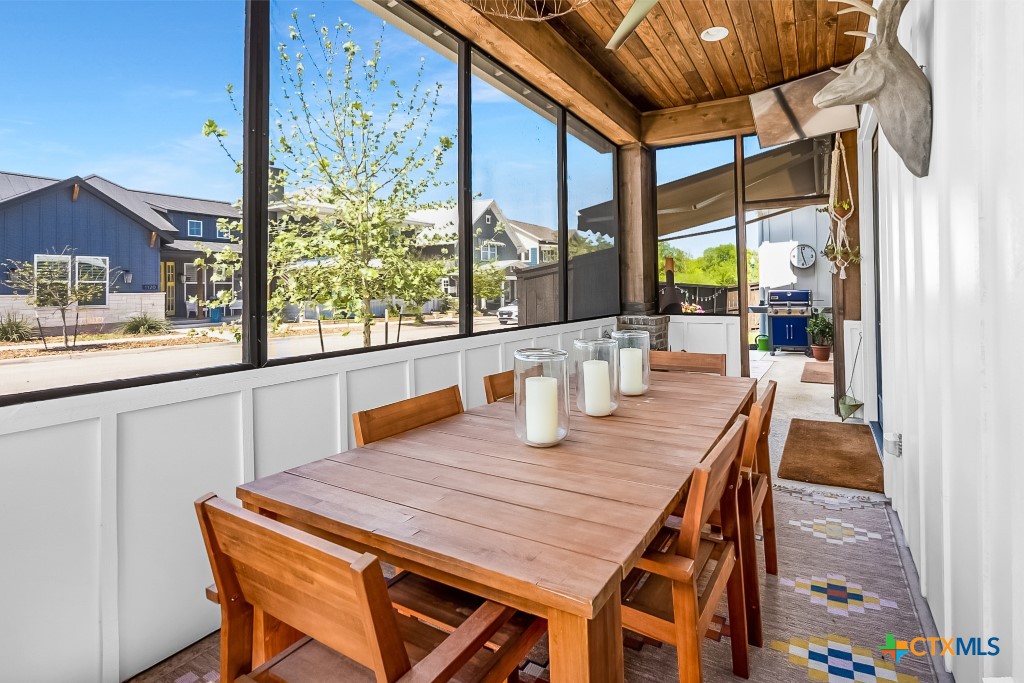 659 Prospect Way New Braunfels, TX 78130 - Photo 6 of 32 a dining room with furniture a rug and wooden floor