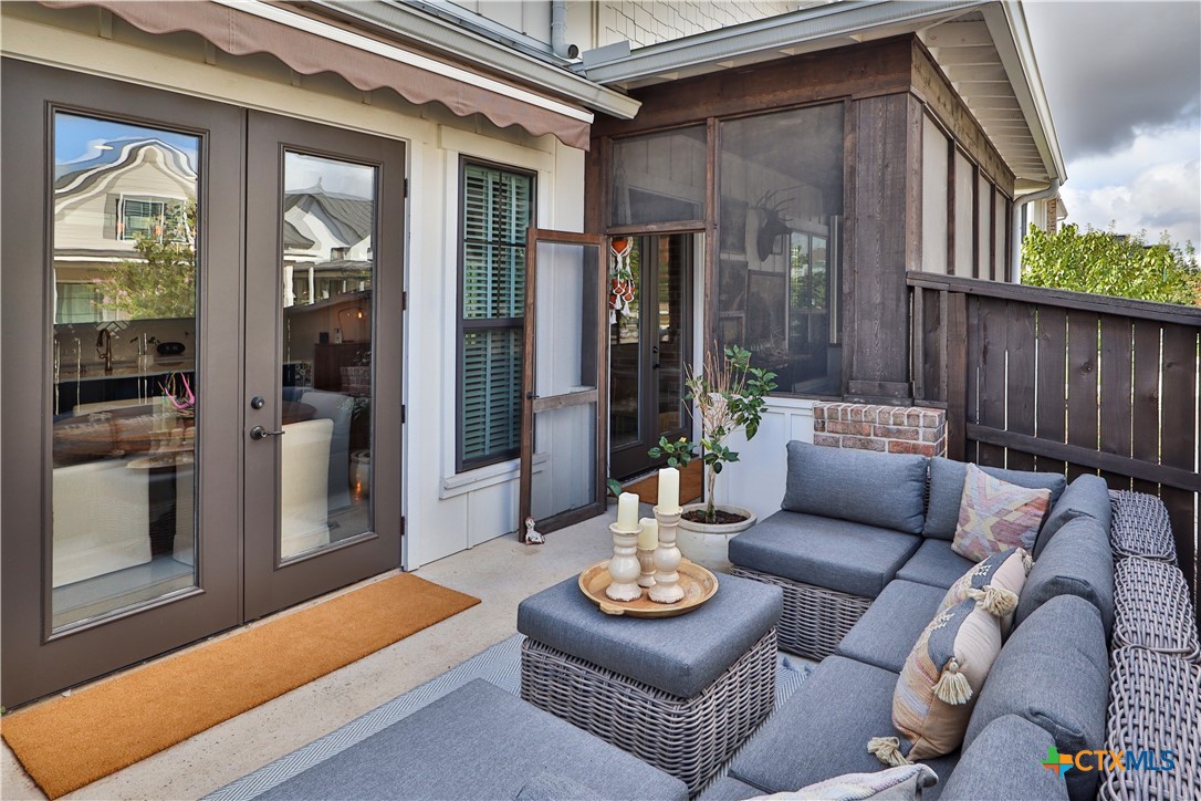 659 Prospect Way New Braunfels, TX 78130 - Photo 8 of 32 a view of a patio with couches table and chairs and potted plants