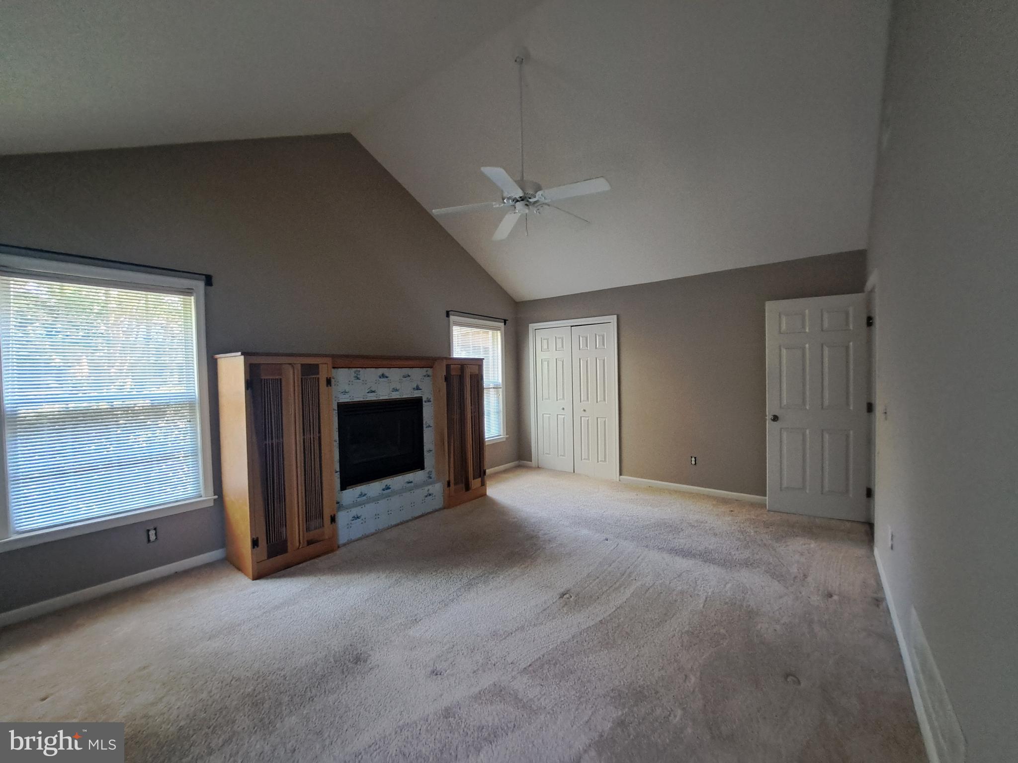 123 New Road Lewes, DE 19958 - Photo 16 of 29 an empty room with windows and fireplace