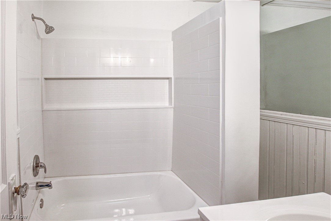 4764 Rockwood Road Cleveland, OH 44125 - Photo 19 of 35 Bathroom with tiled shower / bath and vanity