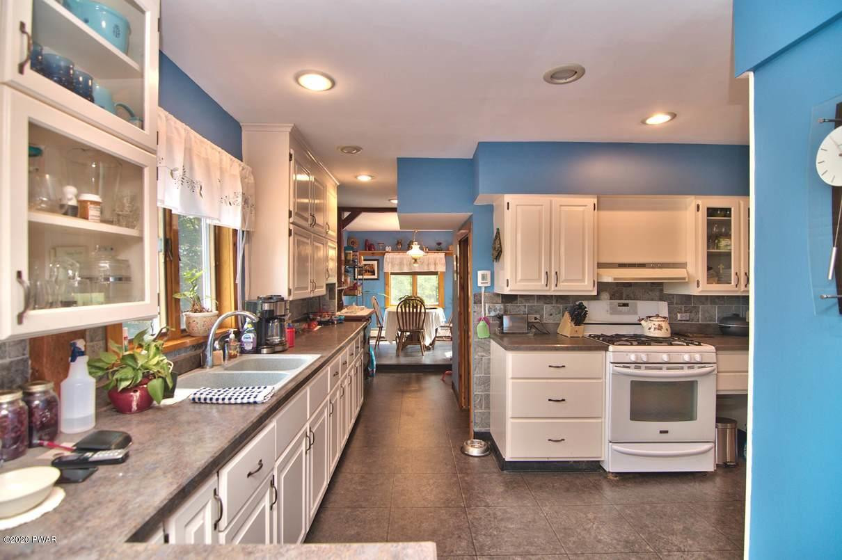 2370 Wrighter Lake Road Thompson, PA 18465 - Photo 21 of 106 Kitchen into Dining Room